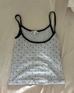 Subdued gray tank top with black polkadots